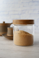 brown sugar in a jar and cup of tea on table , - PhotoDune Item for Sale