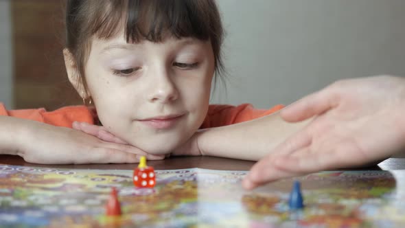 Happy Child with Board Game