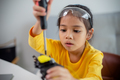 STEM education concept. Asian students learn at home by coding robot arms in STEM. - PhotoDune Item for Sale