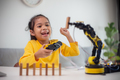 STEM education concept. Asian students learn at home by coding robot arms in STEM. - PhotoDune Item for Sale