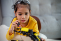STEM education concept. Asian students learn at home by coding robot arms in STEM. - PhotoDune Item for Sale