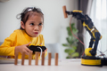 STEM education concept. Asian students learn at home by coding robot arms in STEM. - PhotoDune Item for Sale