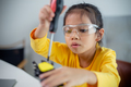 STEM education concept. Asian students learn at home by coding robot arms in STEM. - PhotoDune Item for Sale