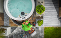 Aerial View of Hot Tub Technician Performing Garden SPA Repair - PhotoDune Item for Sale