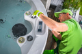Garden SPA Technician Performing Seasonal Hot Tub Maintenance - PhotoDune Item for Sale