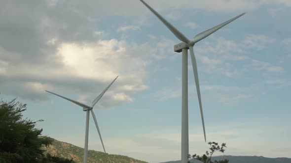 High Windmills Generate Clean Energy with Rotating Blades