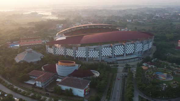 Aerial top down view of the Beautiful scenery of Wibawa Mukti Stadium when sunrise