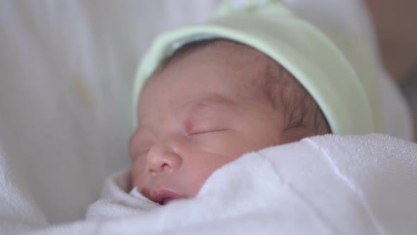 Asian newborn baby boy sleeping, newborn at hospital