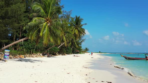 Aerial drone view tourism of perfect sea view beach voyage by blue green ocean and white sandy backg