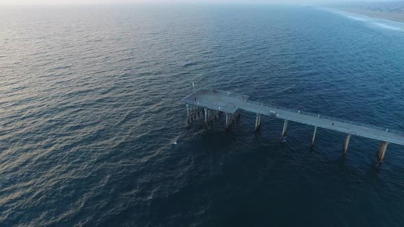 Aerial shot of waves breaking on the beach.