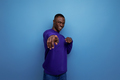 charming cute young african guy in a blue sweatshirt on the background with copy space - PhotoDune Item for Sale