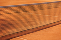 tennis net court made of red clay soil with markings for game or competition. sports and recreation - PhotoDune Item for Sale