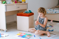 Talented child girl playing with play dough. Hobby, handicraft concept - PhotoDune Item for Sale