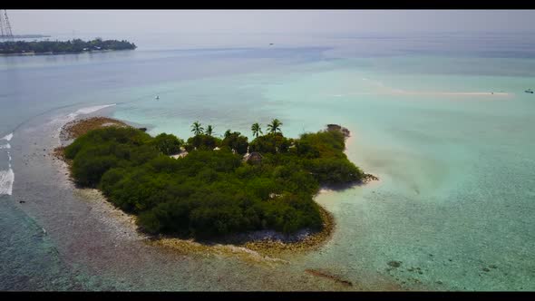 Aerial flying over texture of tropical bay beach lifestyle by blue ocean and white sand background o