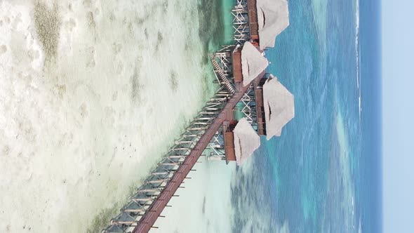 Vertical Video House on Stilts in the Ocean on the Coast of Zanzibar Tanzania Aerial View