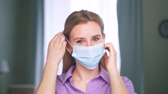 Smiling girl without medical mask looking at the camera, slow motion