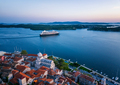 A cruise ship leaving the port of Shibenik in Croatia. - PhotoDune Item for Sale