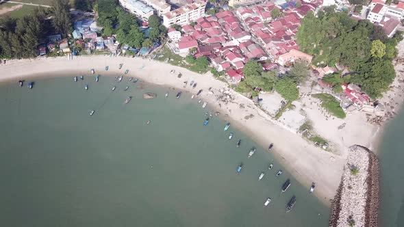 Aerial orbiting fishing village near Tanjung Tokong