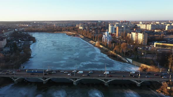 The Vinnytsia City Traffic on the Bridge at the Winter Aerial Sunset View