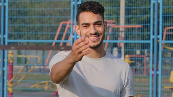 Attractive Arab Sportsman Making Welcome Gesture Inviting to Join Team Promoting Healthy Lifestyle