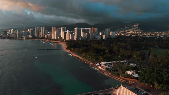 Aerial drone footage of Honolulu, Hawaii. Beautiful real estate, buildings in the city. Palm trees