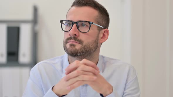 Portrait of Pensive Middle Aged Man Thinking