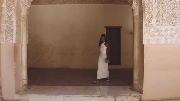 Beautiful Woman In White Walking In Alhambra