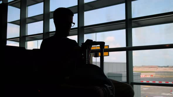 Waiting Passenger at Departure Lounge in Airport