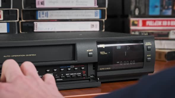 Insert VHS Cassette Into VCR and Push Play Button