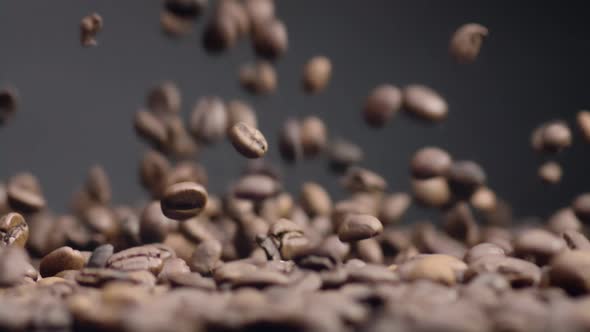 Closeup Coffee Beans Fall on Heap