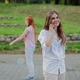 Young Woman Talking on the Phone in the Park - VideoHive Item for Sale