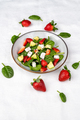 Summer fresh salad with fruits and vegetables in a plate on white background - PhotoDune Item for Sale