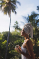 Good Morning of Woman With a Cup of Tea After Shower on Terrace Among Palm Trees - PhotoDune Item for Sale