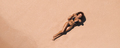 Aerial View of Woman in Bikini on Ideal Pink Sand Beach at the Sea - PhotoDune Item for Sale