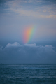 Rainbow Over the Sea Calm Water in the Evening after Raine - PhotoDune Item for Sale