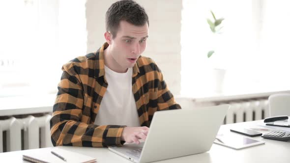 Tense Casual Young Man Reacting to Online Loss