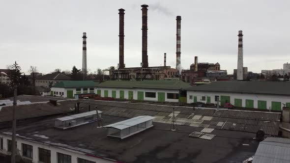 Aerial view of a drone flying over an industrial plant. Plant pipes.