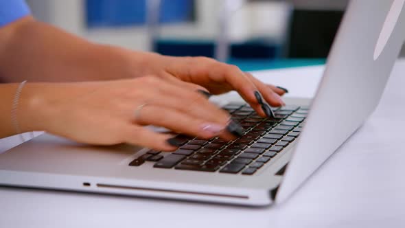 Close Up of Medical Assistant Typing Patient Appointment