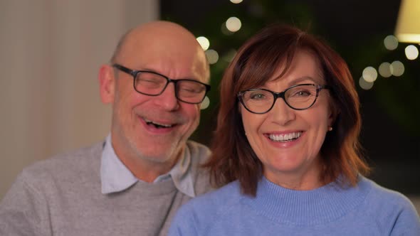 Portrait of Happy Senior Couple at Home in Evening