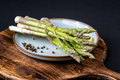 A bunch of fresh asparagus on a wooden board - PhotoDune Item for Sale