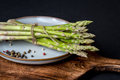 A bunch of fresh asparagus on a wooden board - PhotoDune Item for Sale