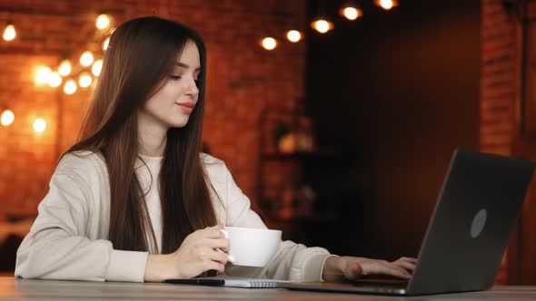 A Woman is Sitting in Her Home Office