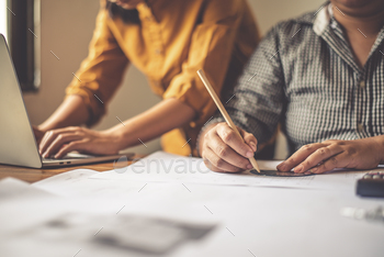 Team of engineers working together in a architect office.
