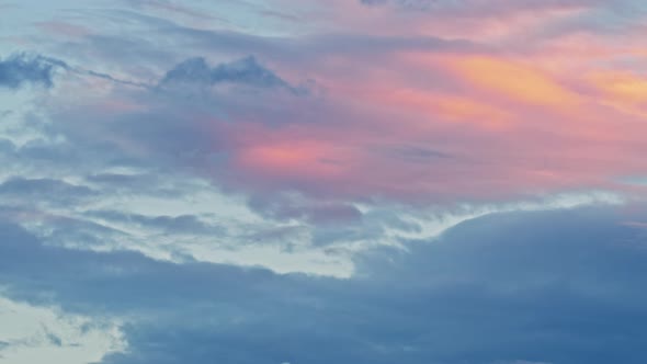 Moving Clouds on Purple Pink Blue Sunset Sky. Dusk, Sunset Time. Beautiful Soft Timelapse.
