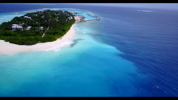 Aerial flying over abstract of tropical coastline beach journey by blue green water with white sandy