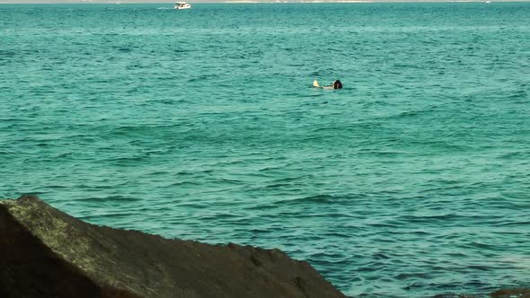 Woman Swims In The Sea