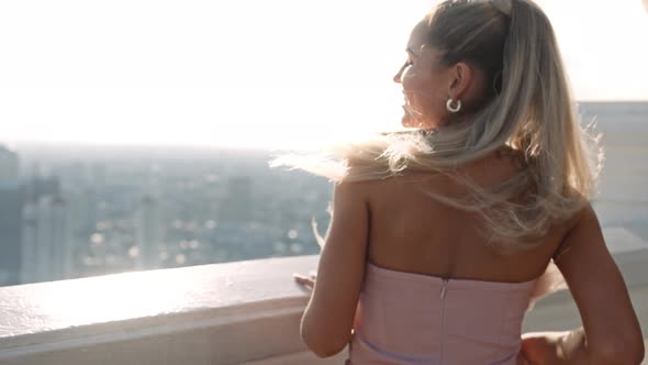 Beautiful Model Smiling By Balustrade Over City