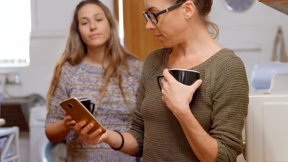 Lesbian couple discussing over a mobile phone 4k