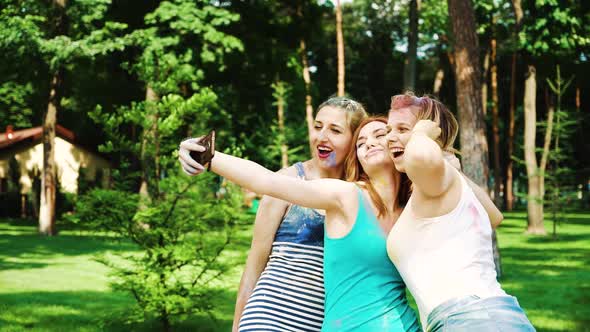 Female Friends Makes Selfie after Celebrating Holi Festival in City Park in Summer