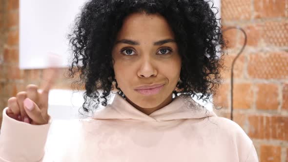 AfroAmerican Woman Waving Finger to Refuse